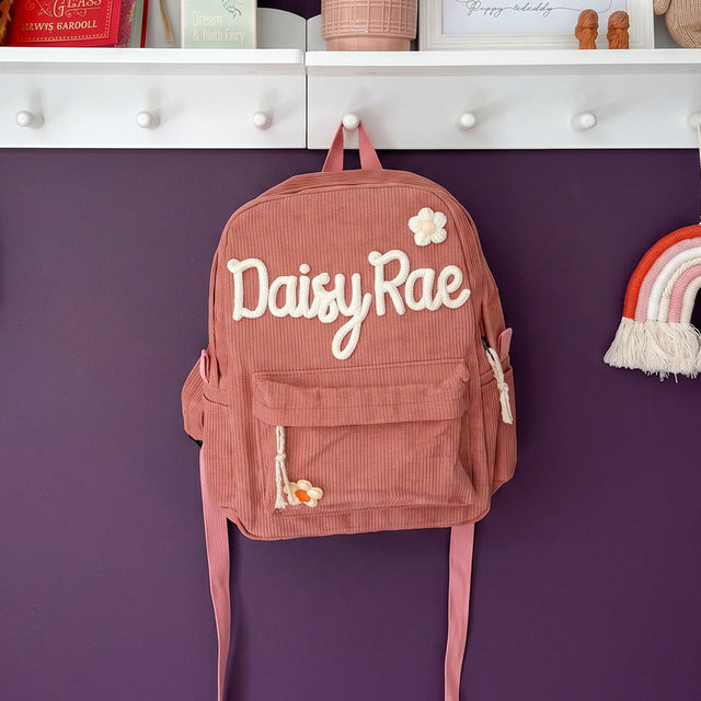 Hand-worked yarn name on a backpack